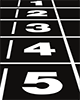 white starting numbers 1 through 5 on a black running track