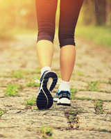 person walking on a trail