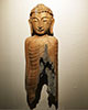 wooden Buddha statue with bottom rotted away