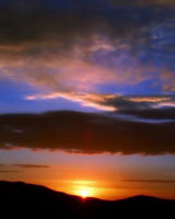 sunset with clouds and mountains