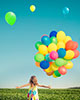 girl with colorful balloons